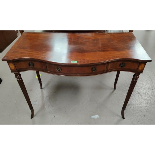 910 - A reproduction Regency style mahogany side/writing table with inlaid decoration, serpentine front an... 