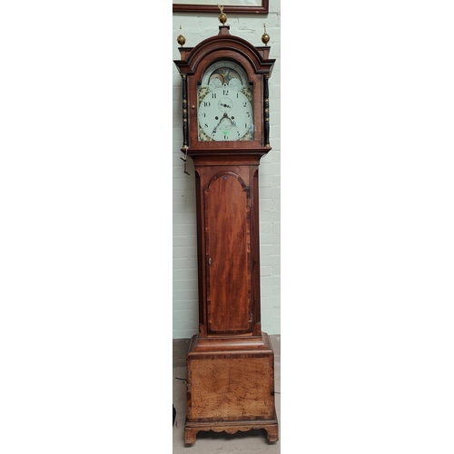 912 - An early 19th century mahogany longcase clock with crossbanded decoration, the hood with brass finia... 