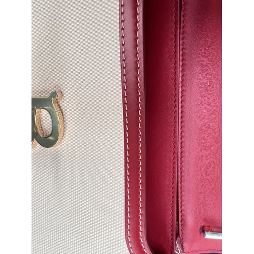 92 - BURBERRY - A two tone canvas and leather small TB bag in natural with dark carmine calf leather trim... 