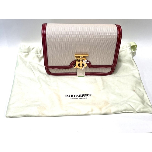 92 - BURBERRY - A two tone canvas and leather small TB bag in natural with dark carmine calf leather trim... 