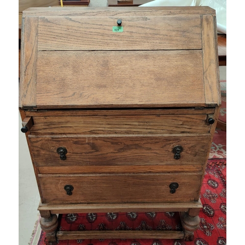 924 - A 1930's oak fall front bureau with 3 drawers under