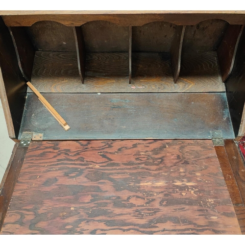 924 - A 1930's oak fall front bureau with 3 drawers under