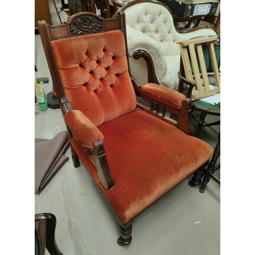 933 - An Edwardian carved mahogany armchair in rust fabric