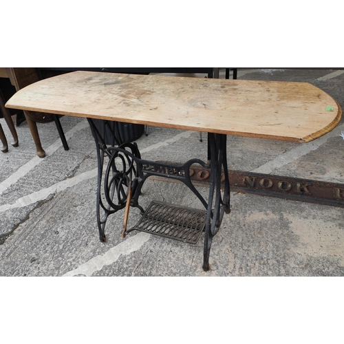 936 - A kitchen table on cast iron base and 4 wheel back dining chairs