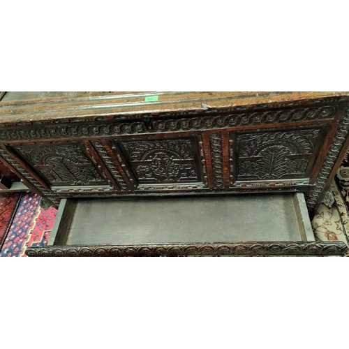 950 - A late 17th/early 18th century fine oak coffer, framed and panelled with extensive carved decoration... 