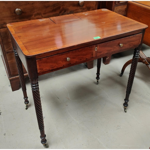 952 - A Regency period crossbanded mahogany side table with tapering rope twist legs and brass castors, wi... 