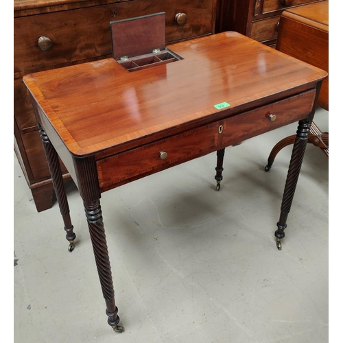 952 - A Regency period crossbanded mahogany side table with tapering rope twist legs and brass castors, wi... 