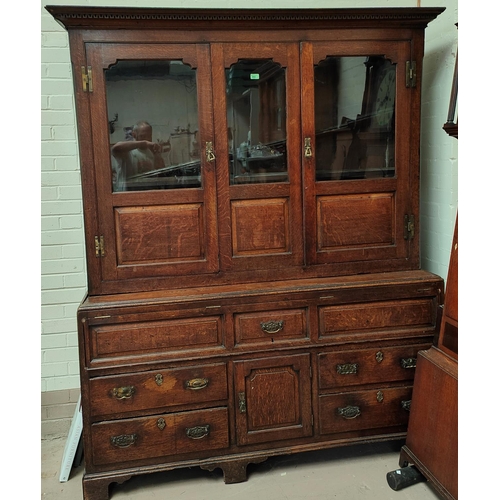 960 - A mid 18th century oak country made dresser/press cupboard with moulded and dentil cornice, the uppe... 