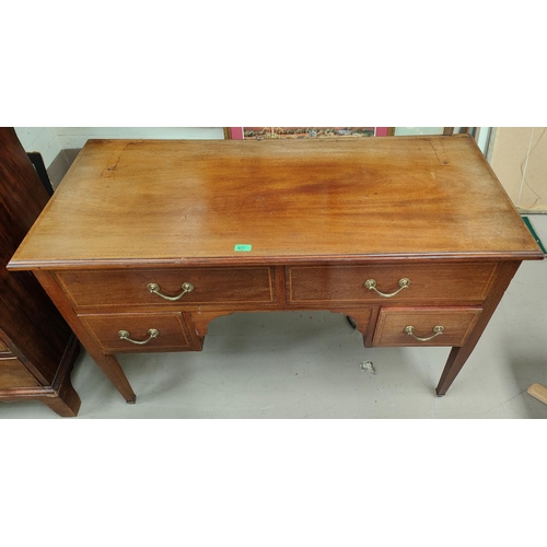 977 - An inlaid mahogany desk with four drawers below