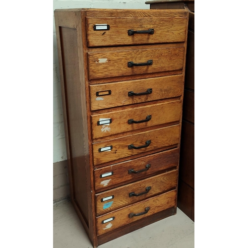 980 - A golden oak chest of 8 small drawers, height 105cm