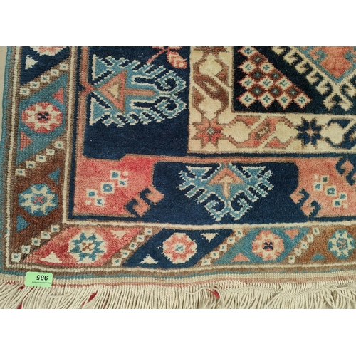 985 - An Eastern blue ground woollen carpet