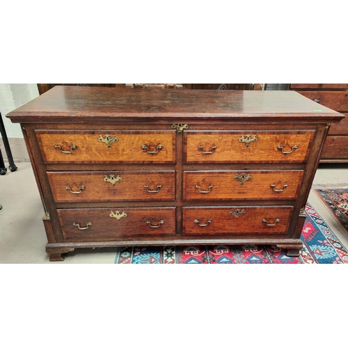 990 - An 18th/19th century oak crossbanded Lancashire chest with four drawers, two top false drawers, carv... 