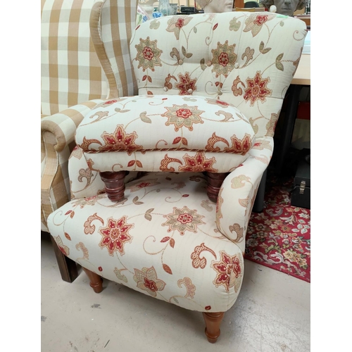 991 - A floral upholstered armchair and footstool 