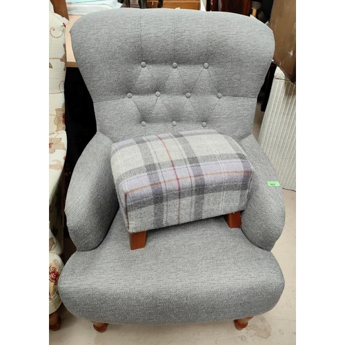 992 - A grey upholstered armchair with button back and a grey tartan footstool