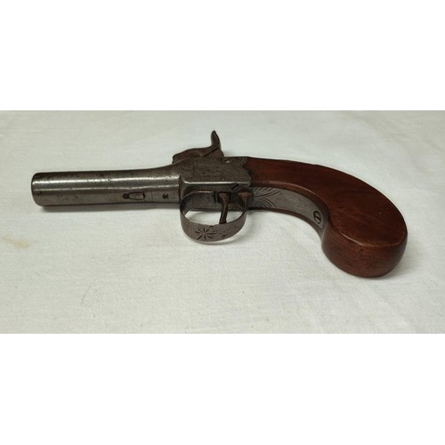 81 - A 19th century muff/pocket percussion pistol, muzzle loading with mahogany grip and scrolled decorat... 