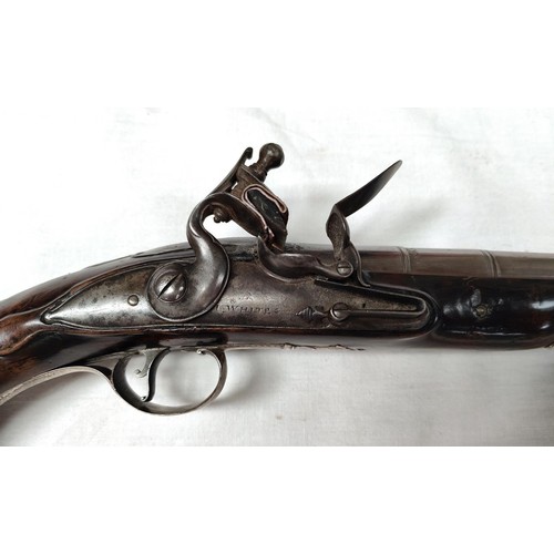 86 - A 19th century flintlock pistol, muzzle loading with white metal mounted decoration and relief carvi... 