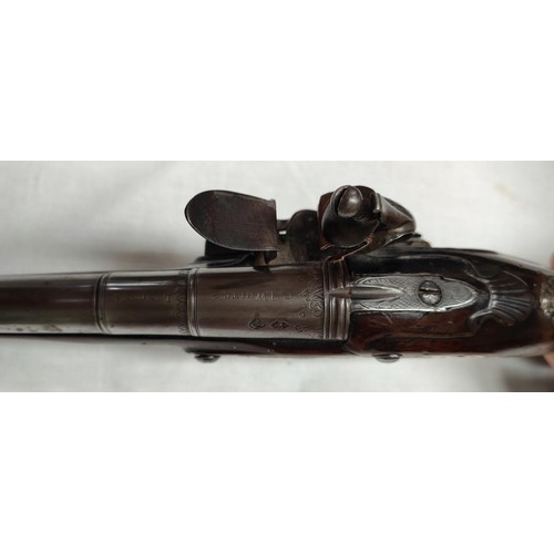 86 - A 19th century flintlock pistol, muzzle loading with white metal mounted decoration and relief carvi... 