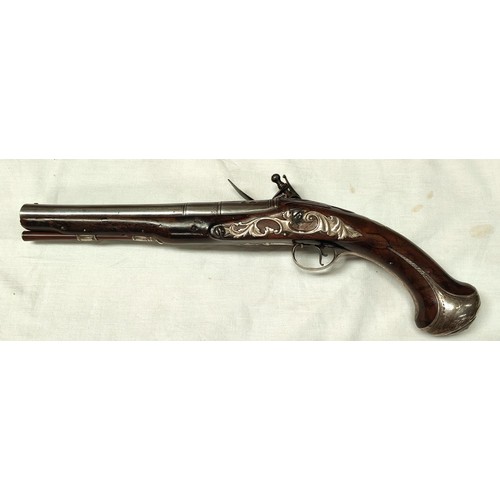 86 - A 19th century flintlock pistol, muzzle loading with white metal mounted decoration and relief carvi... 