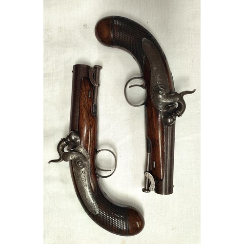 89 - A cased pair of 19th century Irish travelling pistols by Trulock & Son, Dublin, engraved to top ... 