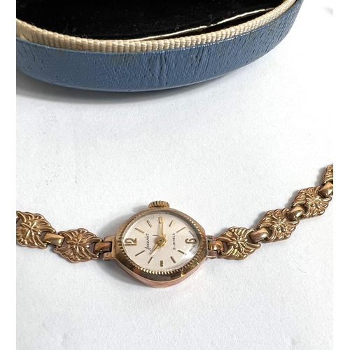 606B - A 9 carat gold lady's Accurist wristwatch with 9 carat gold case and similar floral strap, gross wei... 