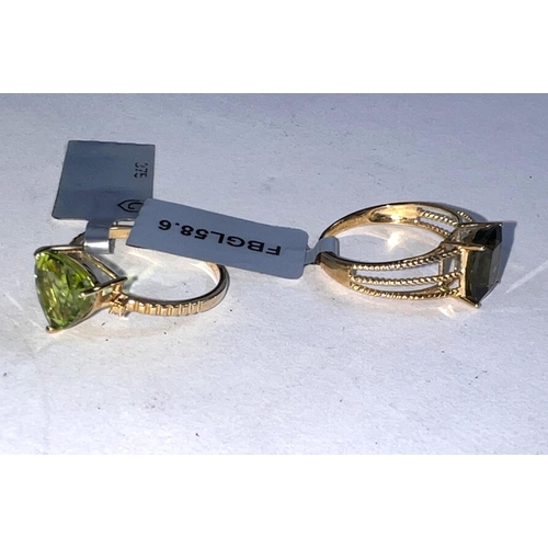 659A - 2 9 carat hallmarked gold dress rings, 1 set with a rectangular Moldorite stone, 1.66carats, size L/... 