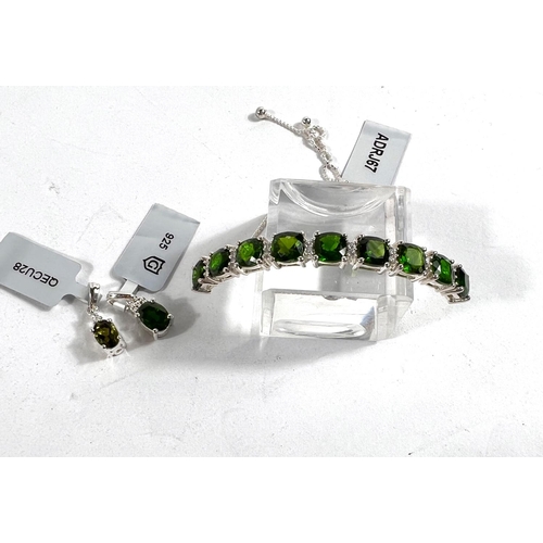 661A - A chrome diopside (9) and white Zircon (20) hallmarked silver slider bracelet; a chrome diopside hal... 