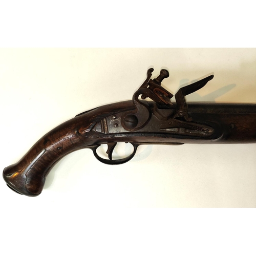 78B - An Austrian Military flintlock pistol with brass mounts, fish tail stock, brass side tangs and cap, ... 