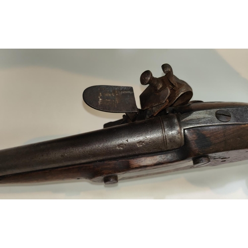 78B - An Austrian Military flintlock pistol with brass mounts, fish tail stock, brass side tangs and cap, ... 