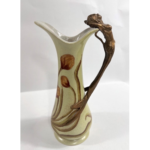 508A - J.B.T. ANNO 1906, Art Nuveau style ceramic jug with brass mermaid handle, height 23cm.