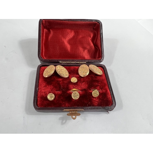 698 - A 9 carat gold cufflinks and studs set, engraved decoration, cased, 7.2gm