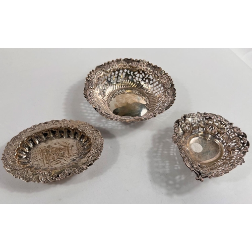 716 - A hallmarked silver circular bonbon dish with pierced decoration; a similar heart shaped dish, Birmi... 