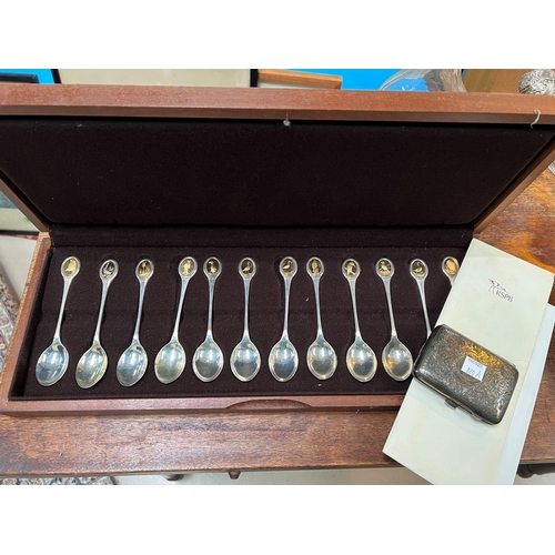 820A - A cased set of 12 hallmarked silver RSPB teaspoons each with a bird to finial,, 10.6oz and a silver ... 