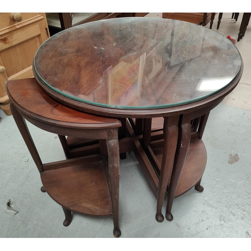 1003 - A 1930's circular nest of tables with 4 1/4 tables fitted below 