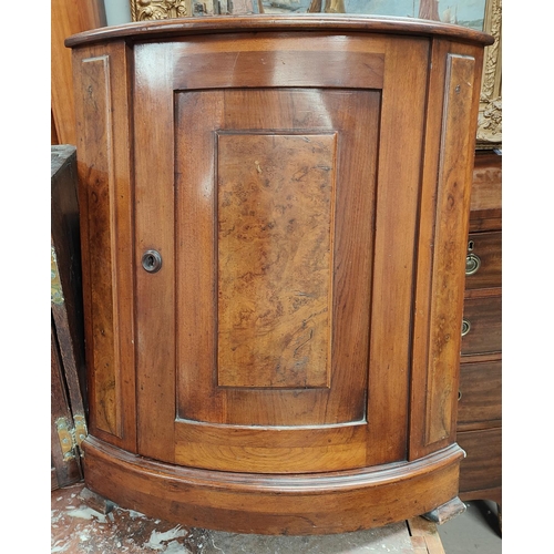 1007 - A mahogany wall hanging bow front corner cupboard with burr walnut panels and a Queen Anne style TV ... 