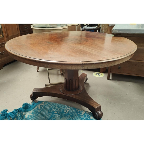 927a - A Victorian supper table with circular tilt top on octagonal column and trefoil base, diameter 124cm