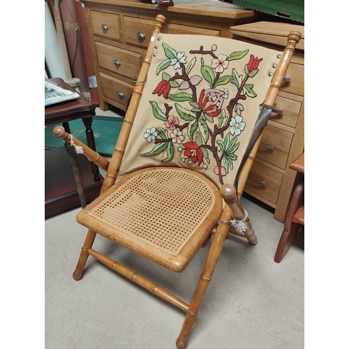 929 - An Edwardian bamboo effect folding armchair