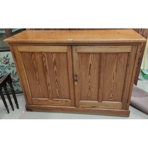 932 - A pitch pine 2 door side cabinet