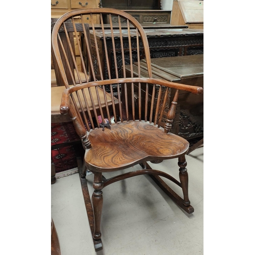 949 - An elm reproduction Windsor rocking armchair