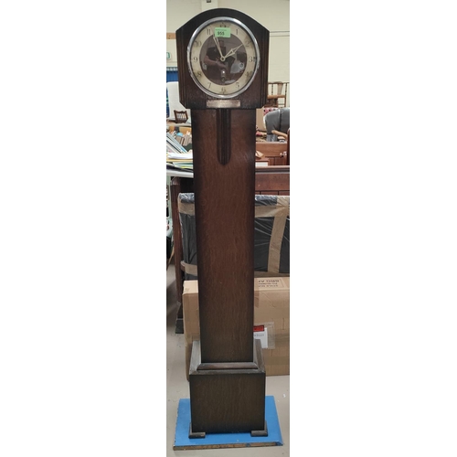 955 - A 1930's chiming granddaughter clock in oak case