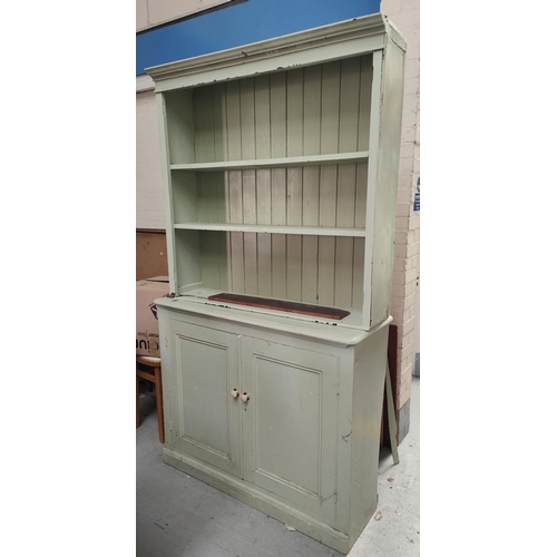 955a - A painted pine dresser with cupboard and drawers below.