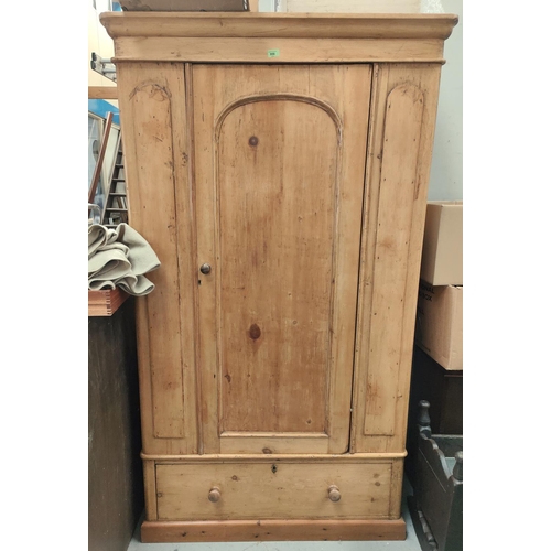 956 - A Victorian stripped pine wardrobe with single door