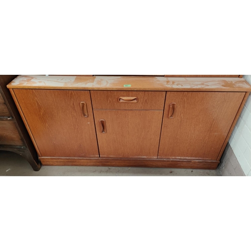 967 - A 20th century teak G-Plan sideboard with three cupboards and single drawer, length 132cm