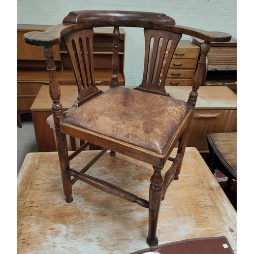 983 - An oak smoker's bow arm chair with leather seat etc