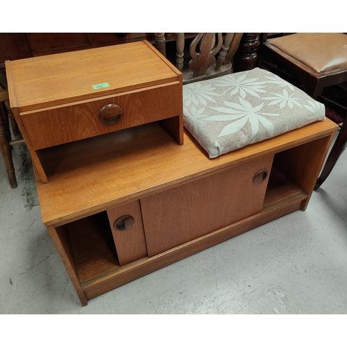 987 - A teak mid 20th century telephone table with sliding doors and single drawer