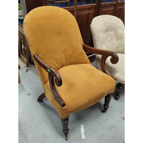 993 - A Victorian mahogany framed armchair with gold upholstery