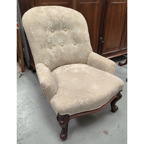 994 - A Victorian armchair with fawn coloured upholstery