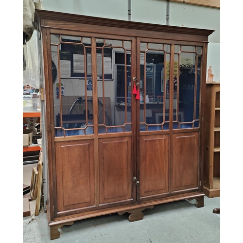 998 - A mahogany bookcase with astragal glazed upper section, panelled section below, 169 x 187 x 47cm