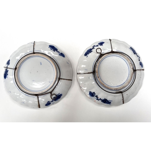 452A - A pair of 19th century Japanese Imari scalloped edged dishes with burnt orange and blue decoration