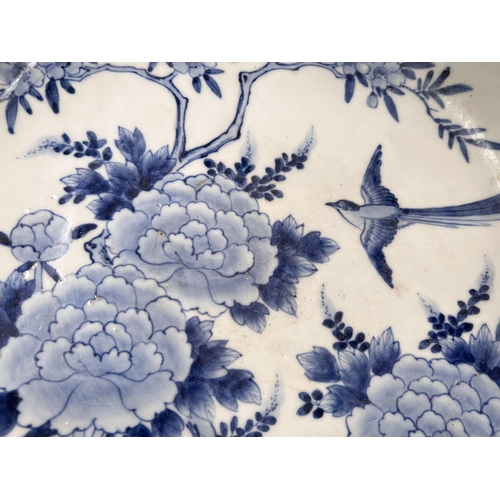 474 - A Chinese blue & white dish decorated with birds and flowers, diameter 27cm; 2 other blue & ... 