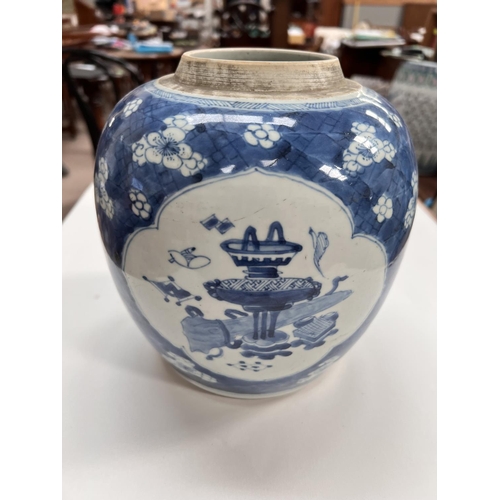 481 - An 19th century Chinese large blue & white ginger jar, decorated with prunus blossom and 3 panel... 